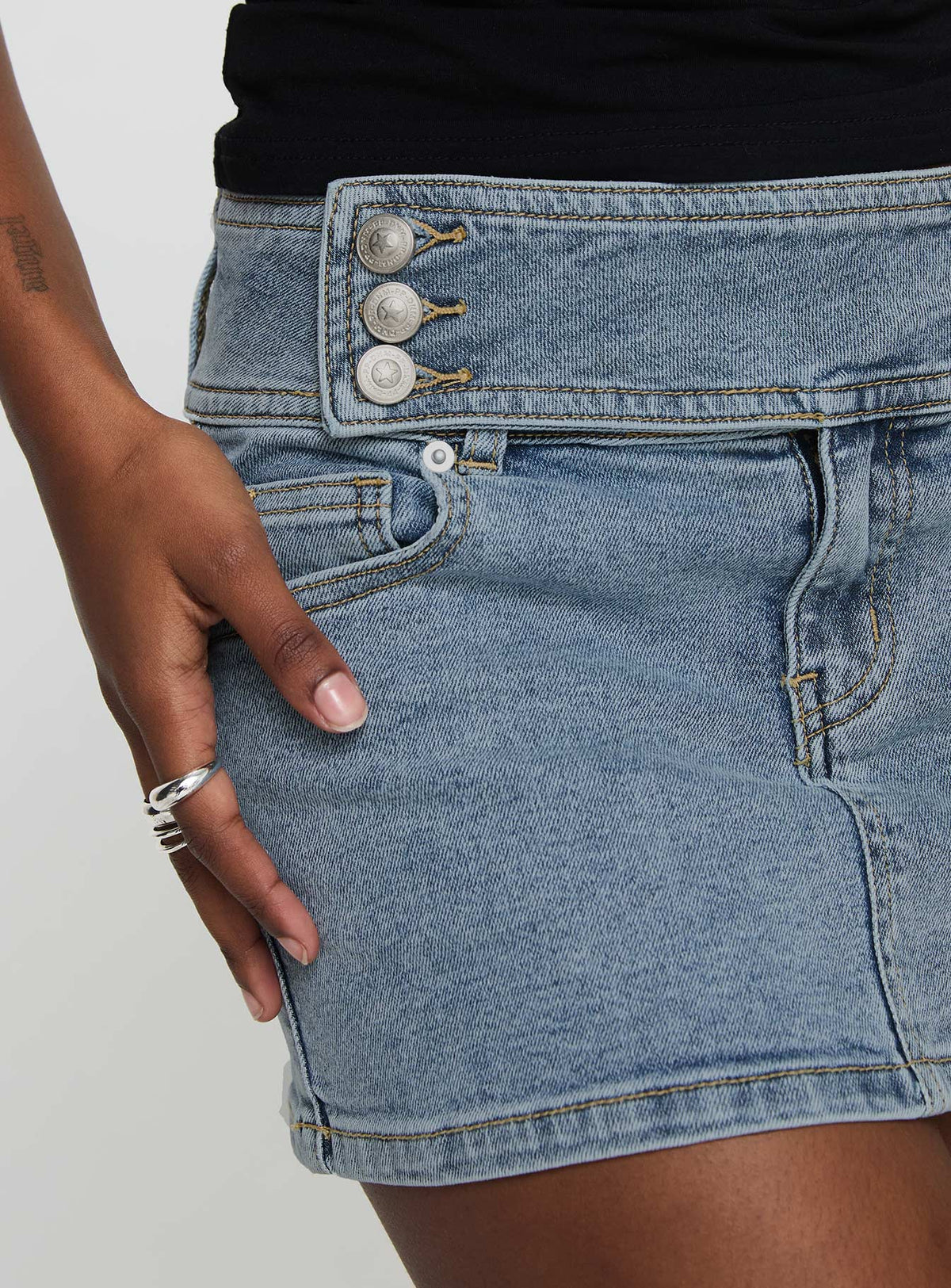 back view of model wearing Princess Polly Brinkman Mini Skirt Light Wash Denim Mini Skirts Skirts 