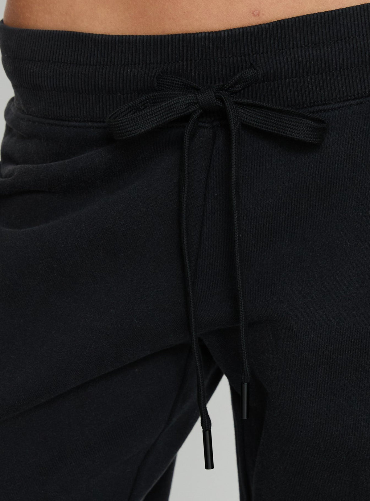 back view of model wearing Princess Polly Dodie Wide Leg Pants Washed Black Mid Rise Pants Pants 