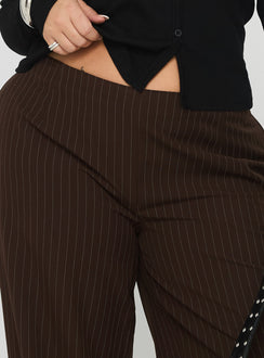 side view of model wearing Princess Polly Khane Low Rise Wide Leg Pant Brown Pinstripe Curve Low Rise Pants Pants 
