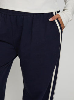 back view of model wearing Princess Polly Circuit Track Pants Navy Curve Pants 