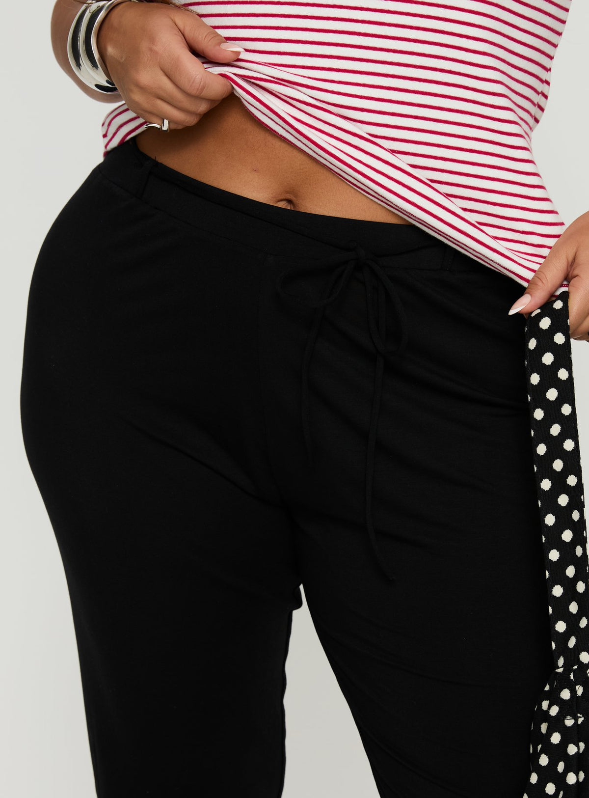side view of model wearing Princess Polly Cayte Capris Black Curve High Rise Pants Pants 