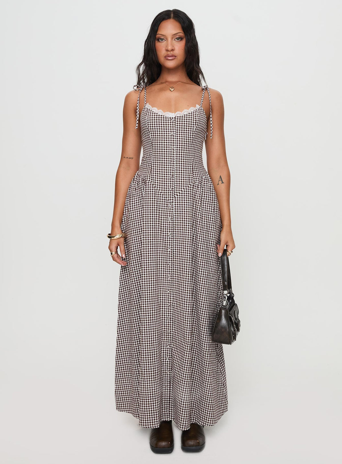 side view of model wearing Princess Polly Dalanie Tie Strap Maxi Dress Brown Gingham Scoop Neck 