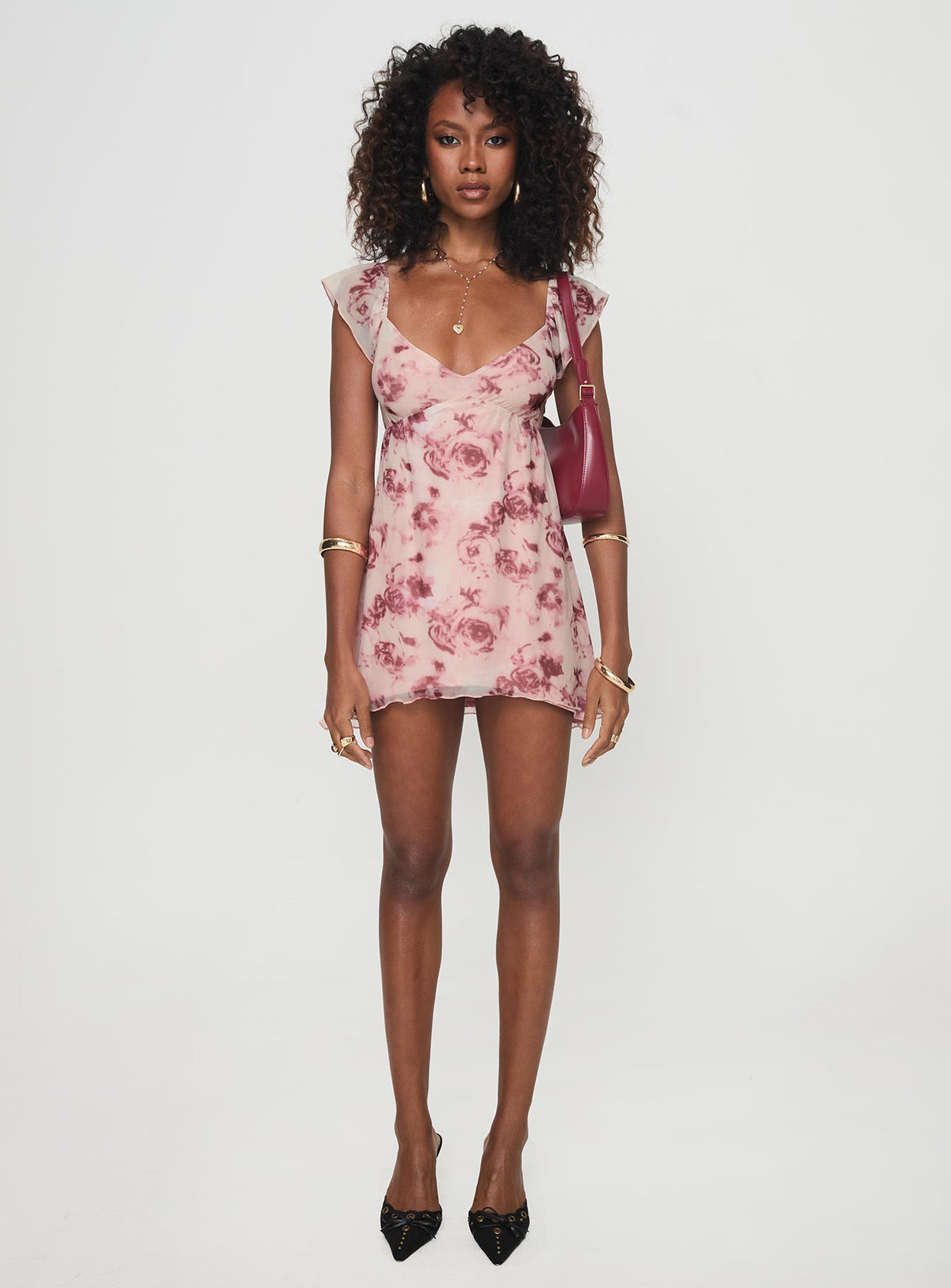 side view of model wearing Princess Polly Trigg Mini Dress Pink Floral Plunger 