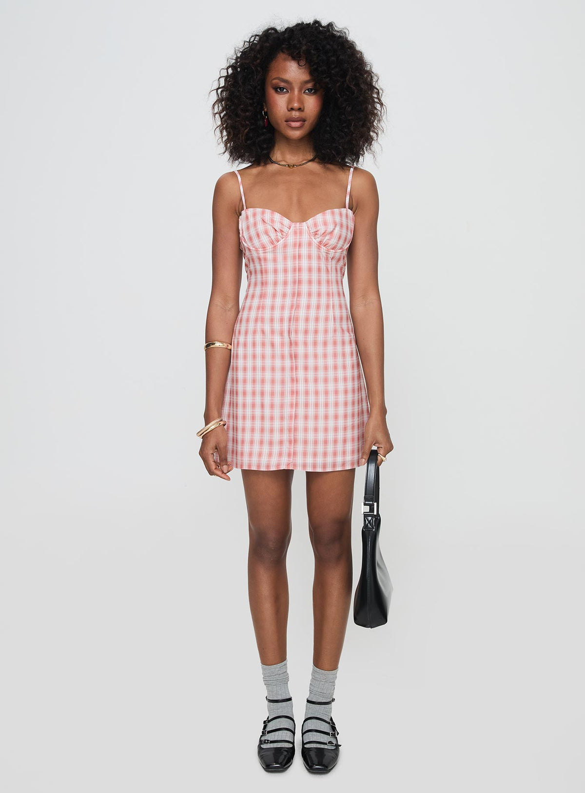 side view of model wearing Princess Polly Poto Mini Dress Pink Check Sweetheart Neckline 