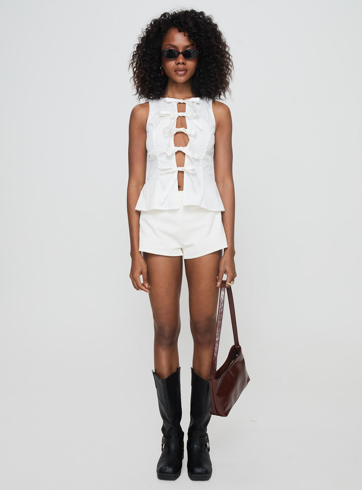 front view of model wearing Princess Polly Luminary Tie Up Top White Sleeveless Crew Neck 