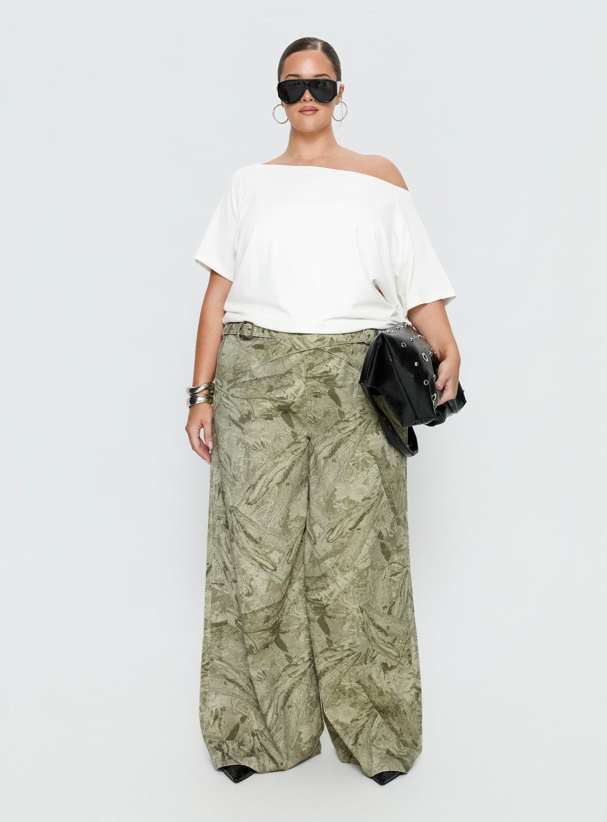 front view of model wearing Princess Polly Mckinley Mid Rise Wide Leg Jeans Camouflage Curve Mid Rise Jeans Jeans 