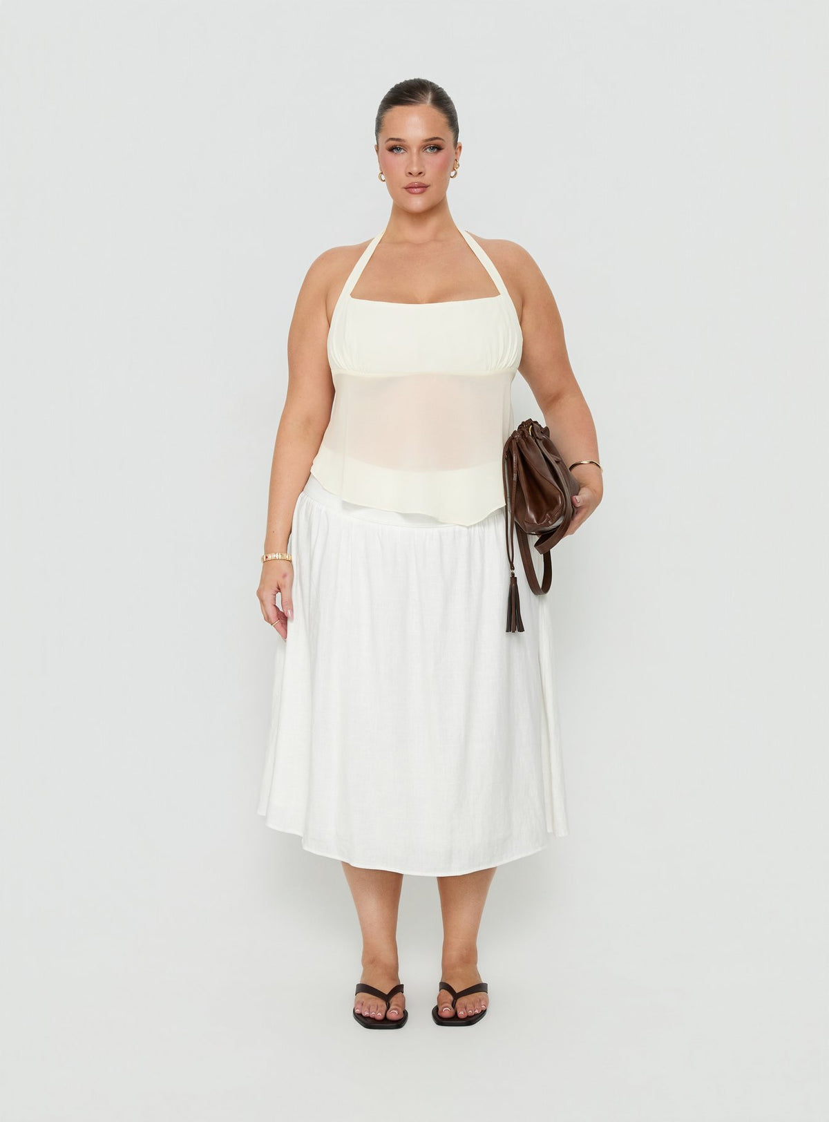 Featuring the Heart Of Gold Linen Blend Midi Skirt White Curve in womens-skirts with midi length front view of model wearing Princess Polly