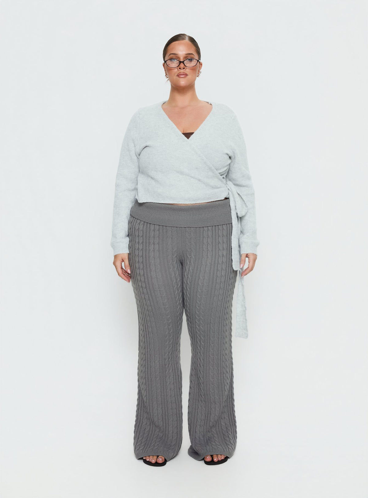 Crafted from soft knit the Tonee Wrap Cardigan Grey Curve in a short length womens jumper with v-neck and oversized fit on-body Princess Polly
