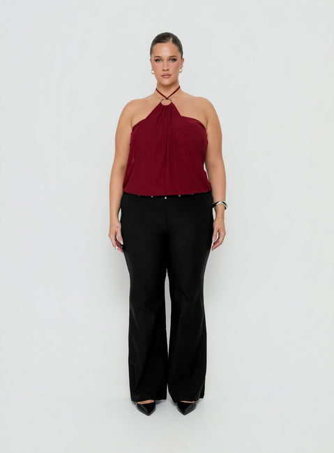 Showcasing the Yevina Eyelet Flare Pant Black Curve womens-regular-pants with mid-rise front view of model wearing Princess Polly