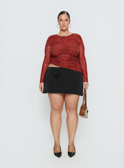   side view of model wearing Princess Polly Nadya Satin Tailored Mini Skirt Black Curve Skirts 