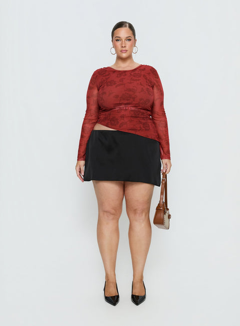   side view of model wearing Princess Polly Nadya Satin Tailored Mini Skirt Black Curve Skirts 