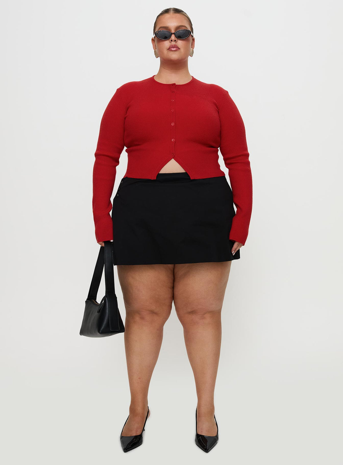 front view of model wearing Princess Polly Sora Skort Black Curve High Waisted Shorts 
