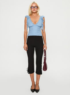 side view of model wearing Princess Polly Miztry Top Blue Polka Sleeveless Plunger 