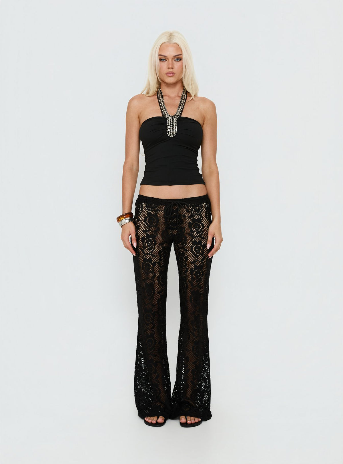 Featuring Rosadonna Lace Flare Pants Black in womens regular pants with mid-rise front view of model wearing Princess Polly