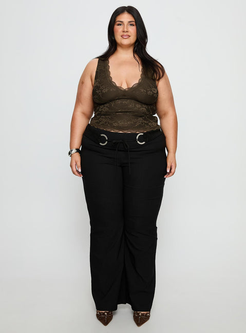 side view of model wearing Princess Polly Twinflame Low Rise Hardware Pants Black Curve Mid Rise Pants Pants 