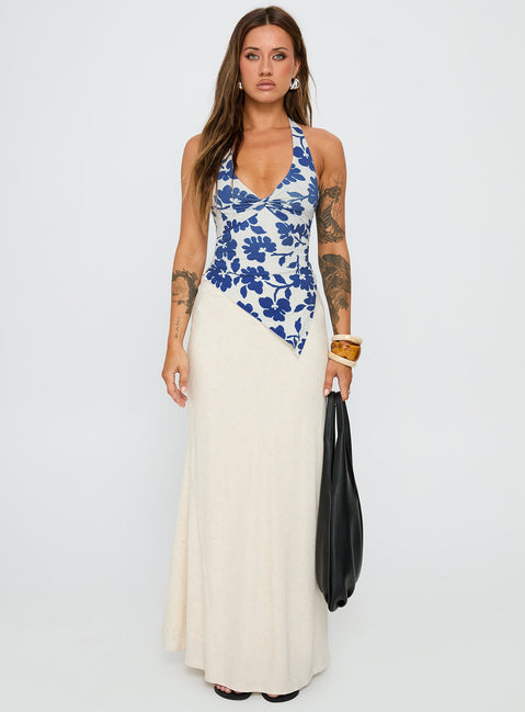 side view of model wearing Princess Polly Chilli Halter Top Blue Floral Sleeveless Plunger 