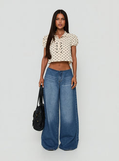 Showcasing the Roamer No Waist Low Rise Super Baggy Vintage Mid Blue womens jeans with low-rise waist front view of model wearing Princess Polly
