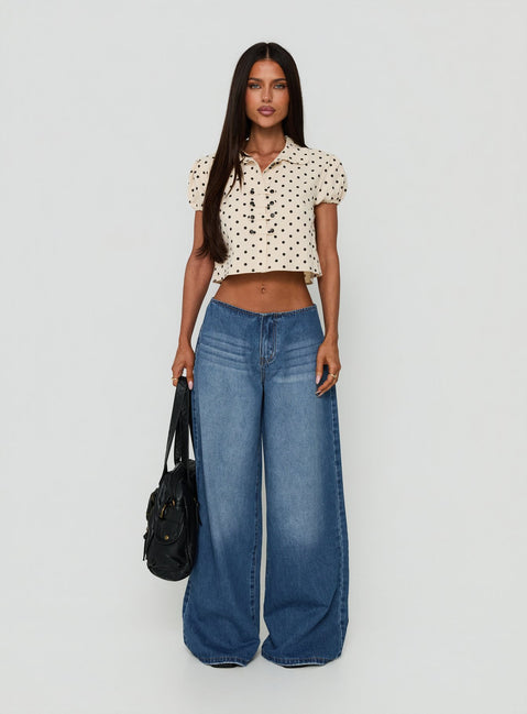 Showcasing the Roamer No Waist Low Rise Super Baggy Vintage Mid Blue womens jeans with low-rise waist front view of model wearing Princess Polly