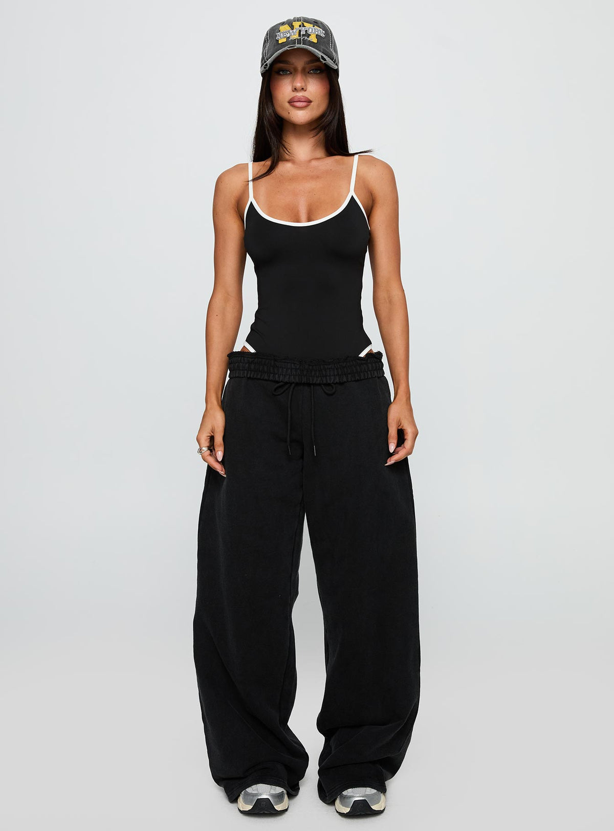 side view of model wearing Princess Polly That Effect Bodysuit Black Sleeveless Bodysuit 
