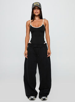 side view of model wearing Princess Polly That Effect Bodysuit Black Sleeveless Bodysuit 