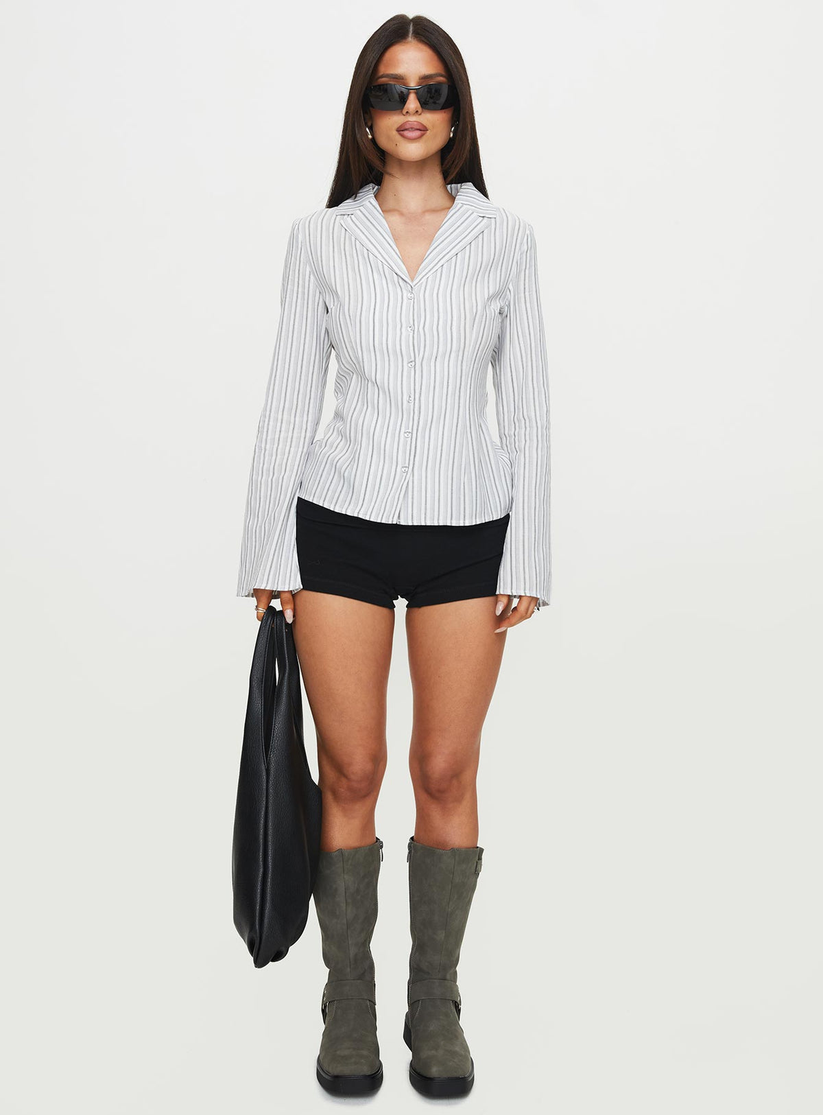 side view of model wearing Princess Polly Myers Stripe Top White Full Sleeves V-Neck 