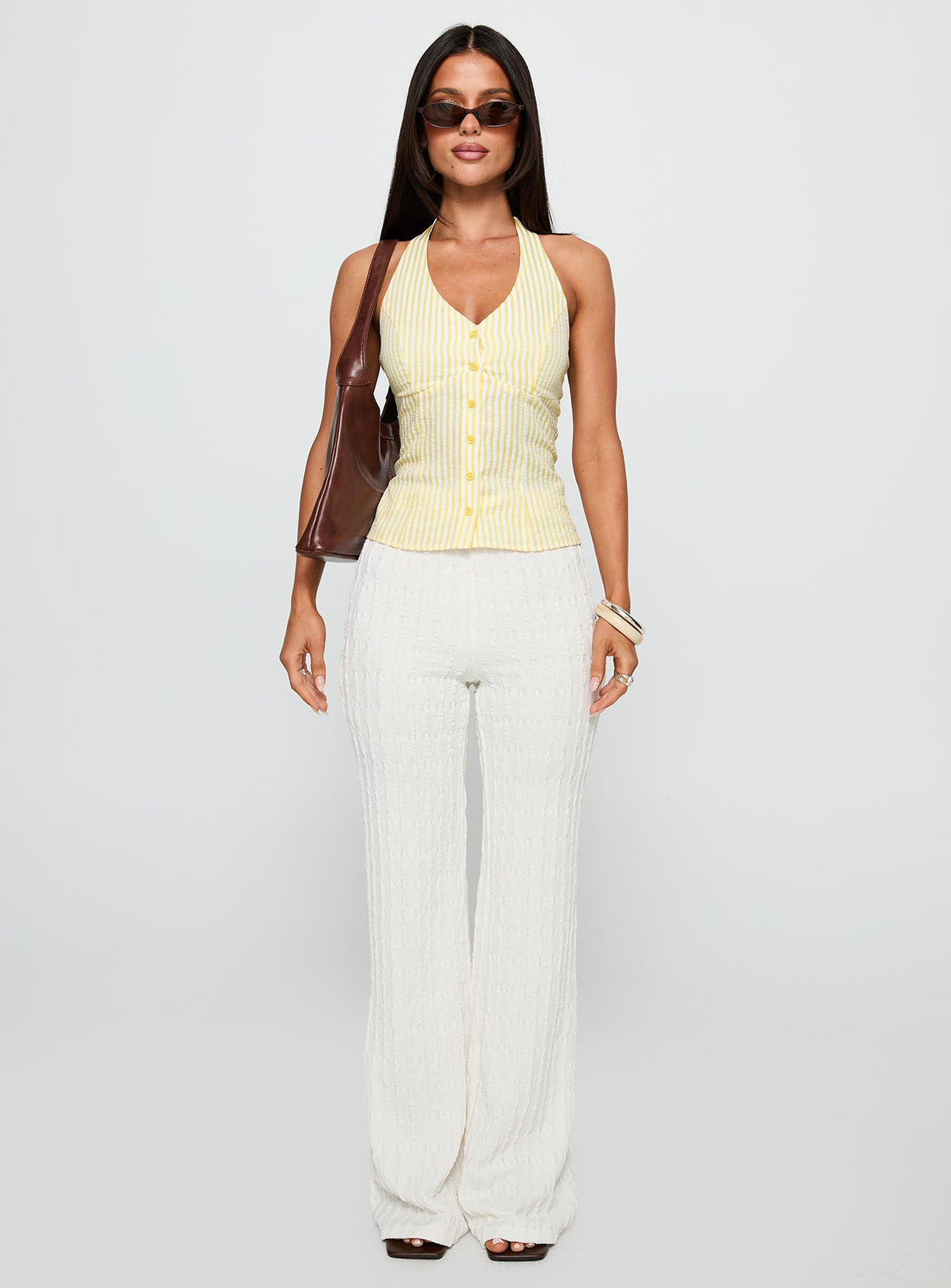 side view of model wearing Princess Polly Old Friend Halter Top Yellow Stripe Sleeveless V-Neck 