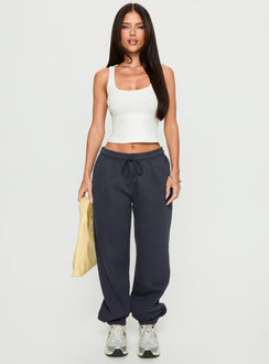 front view of model wearing Princess Polly Caspa Dream Fleece Oversized Ankle Cuff Jogger Navy High Rise Pants Pants 