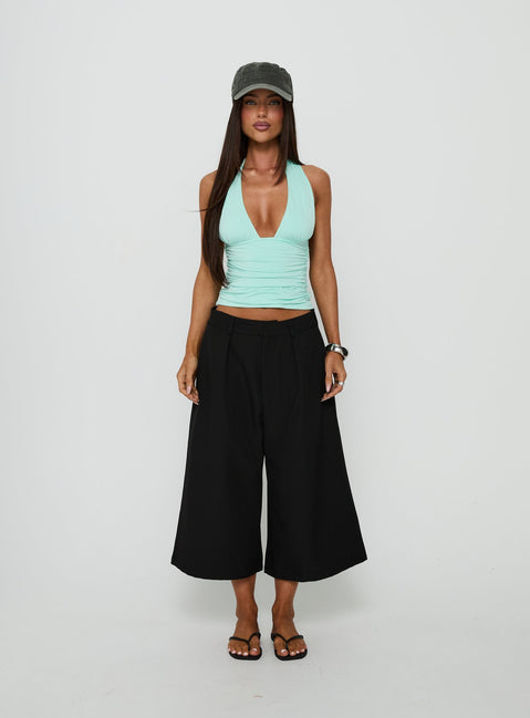 Styled in the Busy Busy Low Baggy Capri Pant Black in womens-regular-pants with low-rise on-body view of model wearing Princess Polly