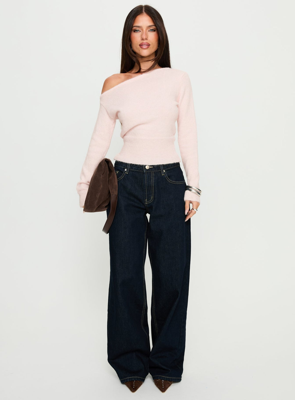 side view of model wearing Princess Polly Serenitia Mid Rise Relaxed Jeans Dark Raw Wash Mid Rise Jeans 