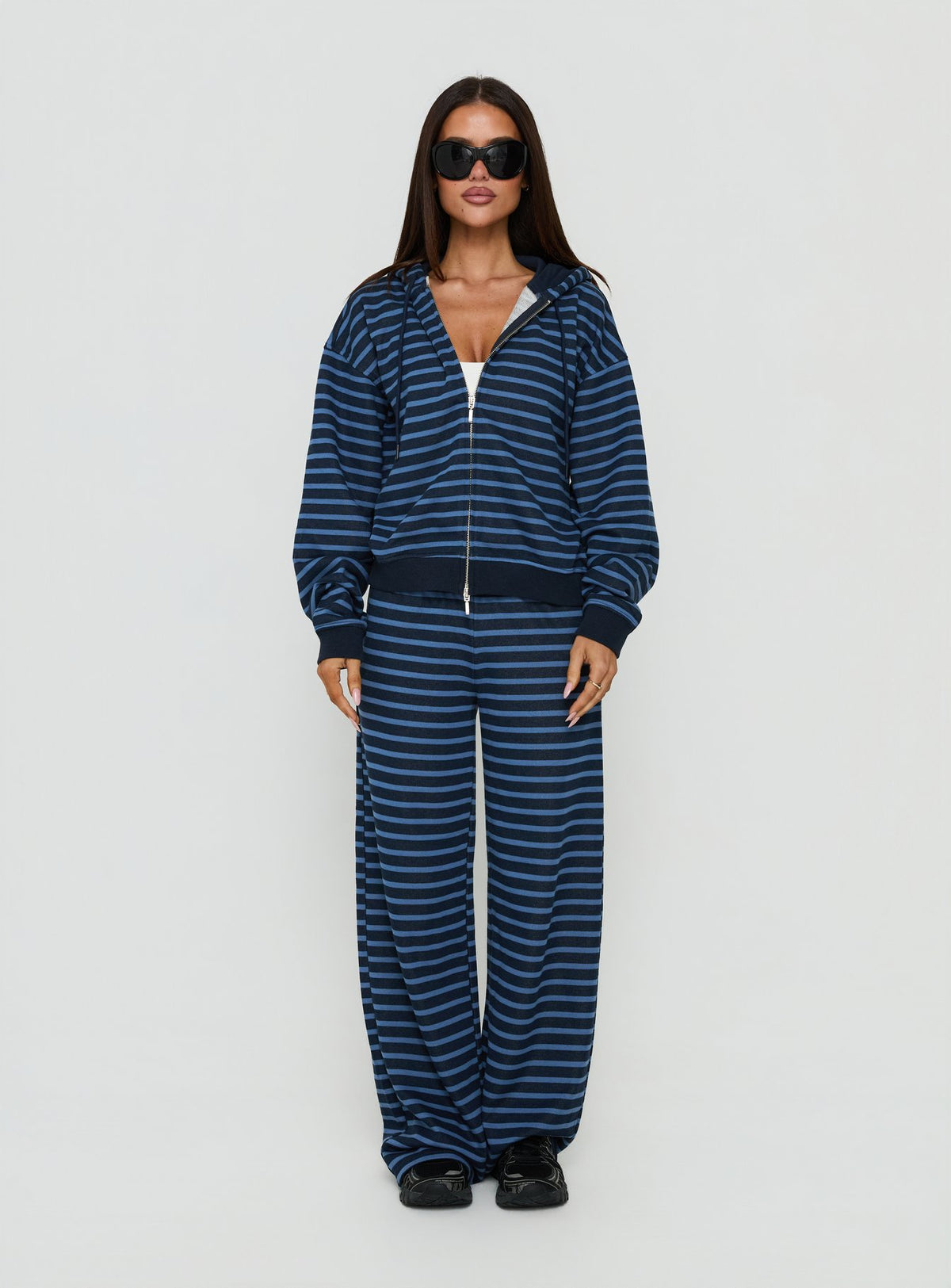 Style shot showcasing the Delaeni Zip Through Hoodie Blue Stripe womens-jumpers in short length front view of model wearing Princess Polly