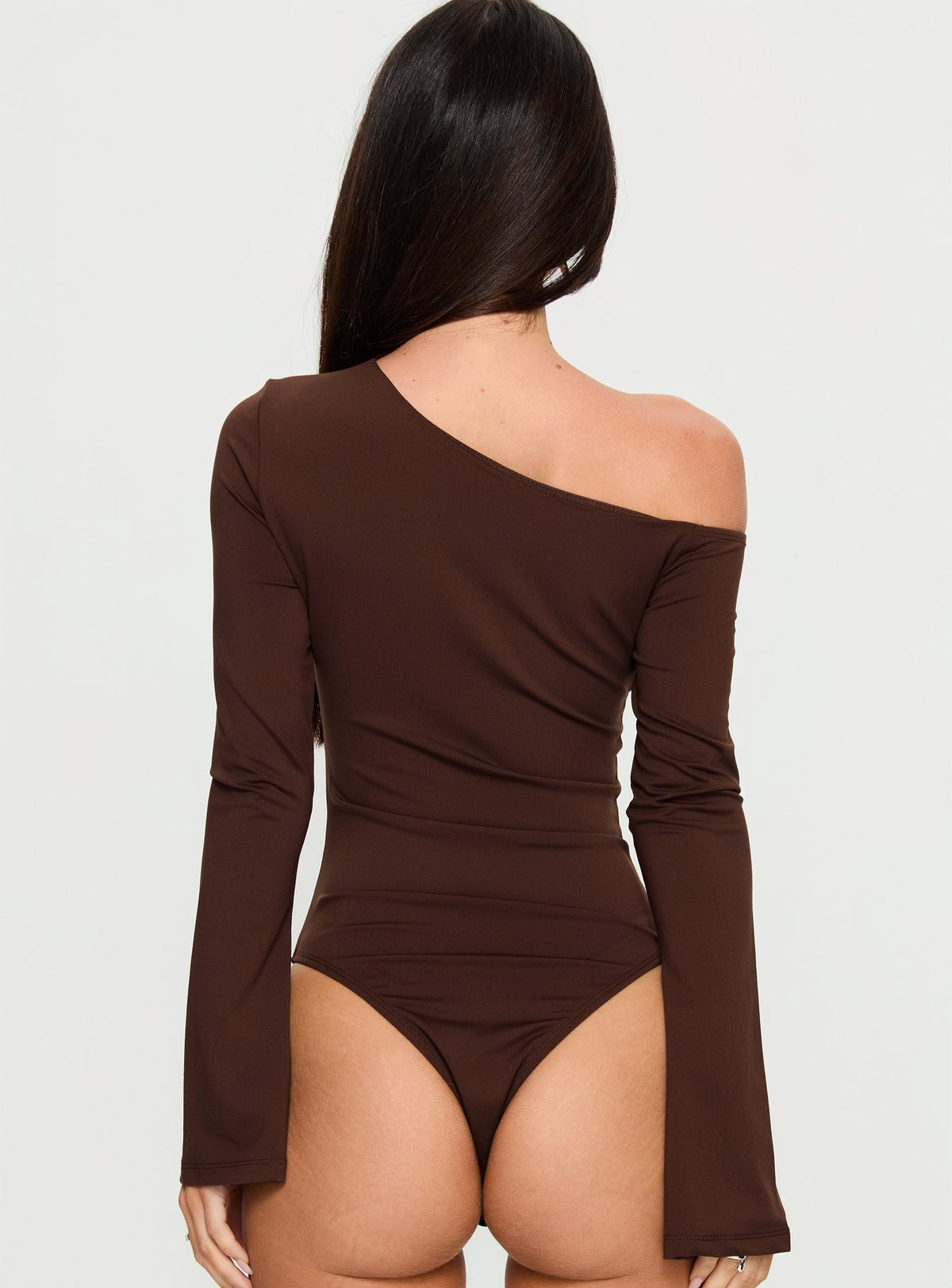 back view of model wearing Princess Polly Raissa Cut Out One Shoulder Bodysuit Brown Long Sleeve Tops Bodysuit 