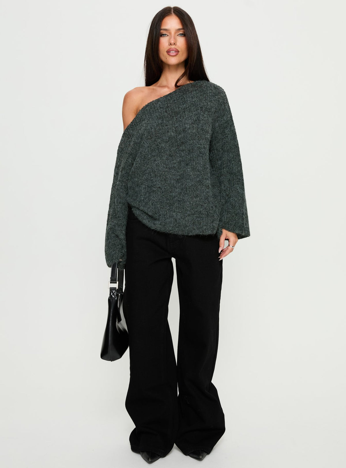 Showcasing the Delyn Off Shoulder Slouchy Knit Sweater in Black Marle, a womens jumper with short length front view of model wearing Princess Polly