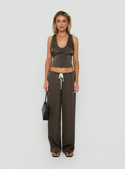 Showcasing the Dialled Up Tie Waist Satin Pants Mocha in womens regular pants with mid-rise detail front view of model wearing Princess Polly