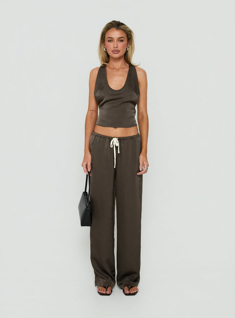 Showcasing the Dialled Up Tie Waist Satin Pants Mocha in womens regular pants with mid-rise detail front view of model wearing Princess Polly