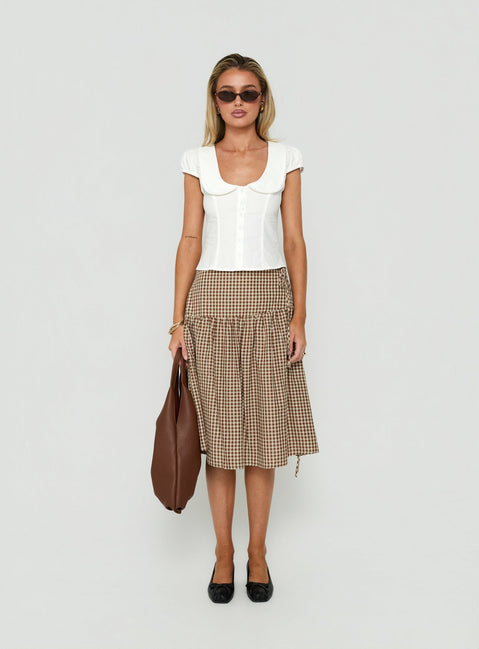 Featuring the Kasida Tie Detail Midi Skirt Brown Check in womens-skirts with midi length front view of model wearing Princess Polly