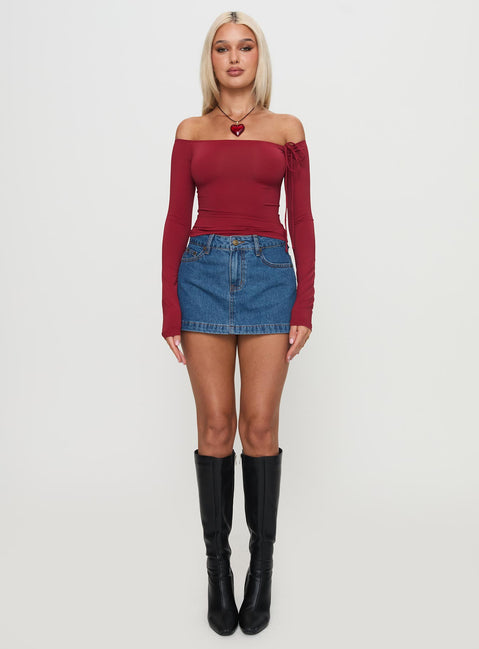   side view of model wearing Princess Polly Nicolina Low Rise Denim Mini Skirt Light Wash Tall Mini Skirts Skirts 