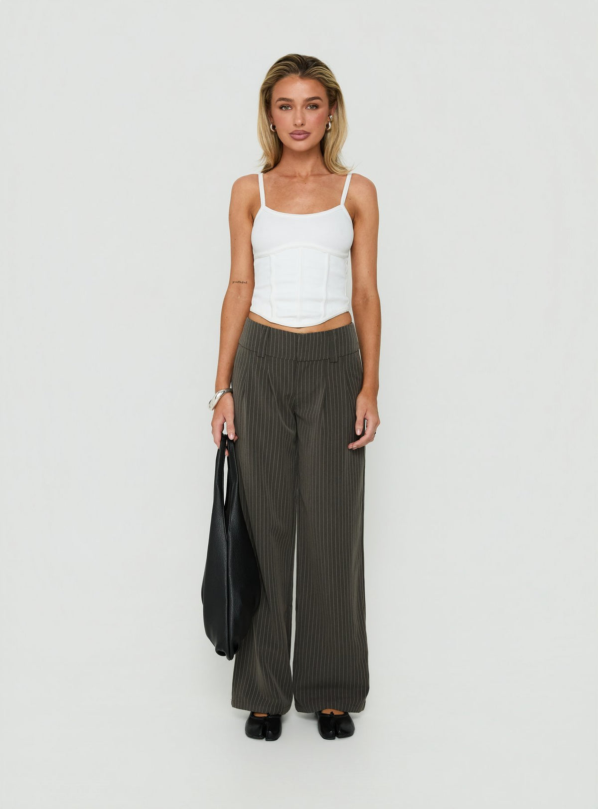Experience the Two Lovers Low Rise Pants Grey Pinstripe in womens-regular-pants front view of model wearing Princess Polly