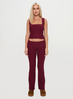front view of model wearing Princess Polly Closed Eyes Flared Pants Maroon Low Rise Pants Pants 