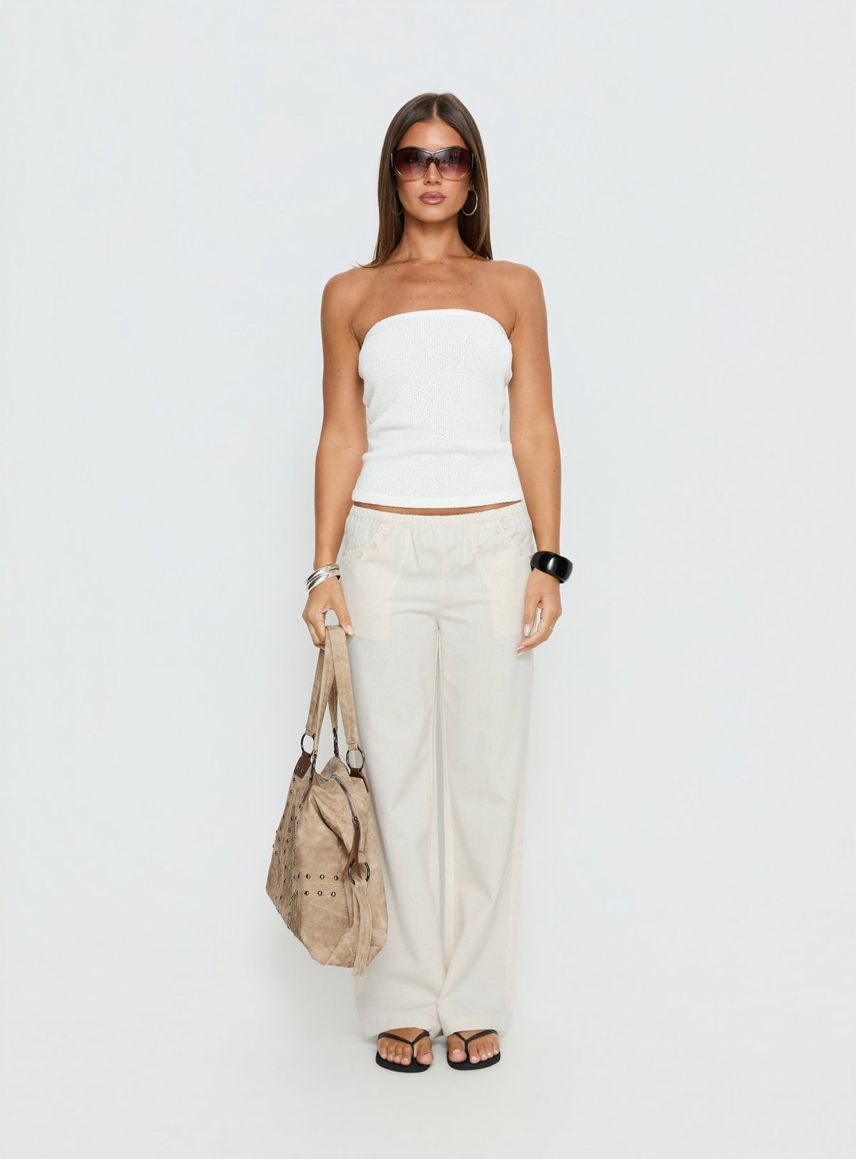 front view of model wearing Princess Polly Around The Clock Button Detail Mid Rise Wide Leg Pants Cream Mid Rise Pants Pants 