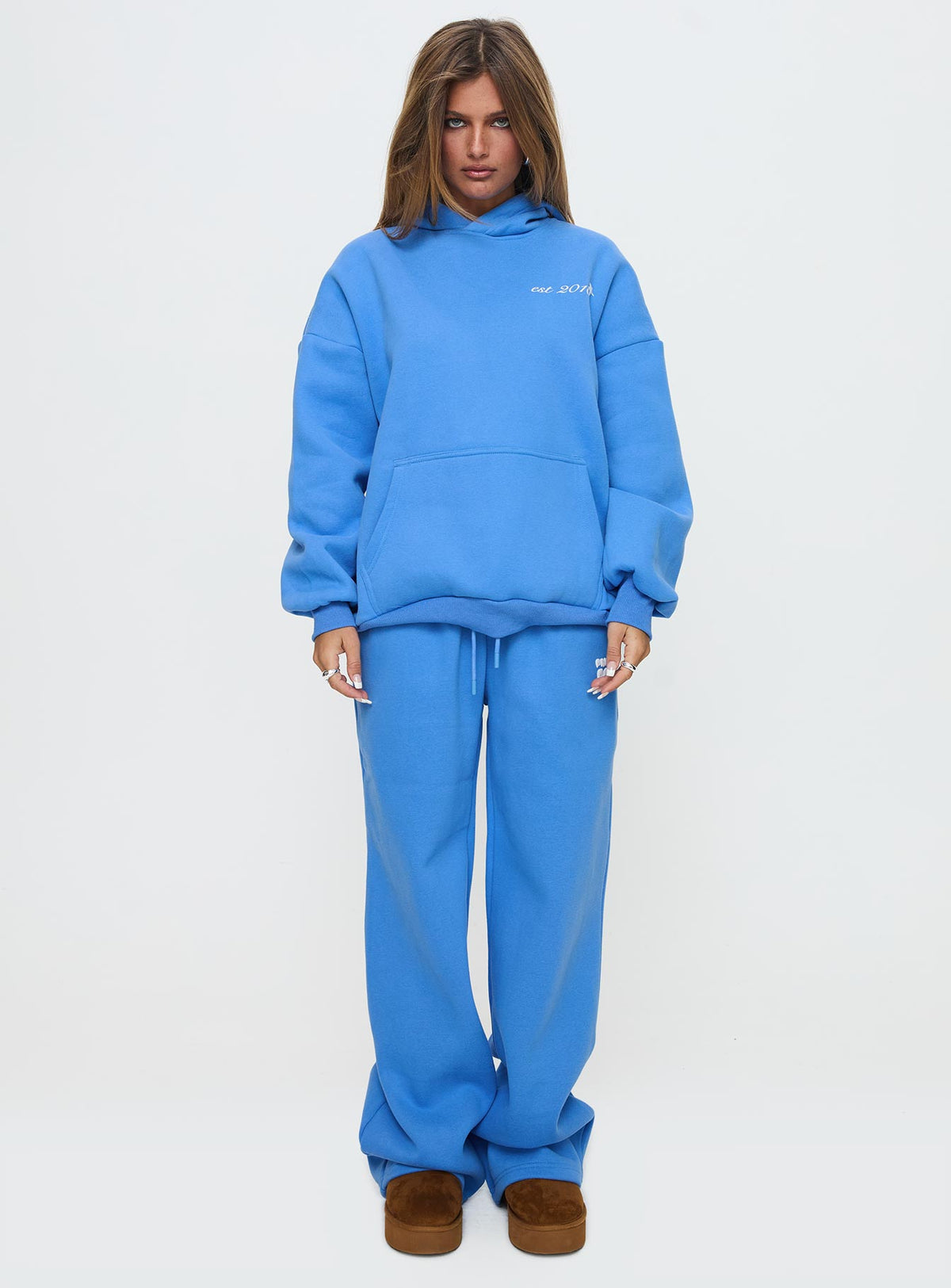 front view of model wearing Princess Polly Princess Polly Wide Leg Track Pant Bubble Text Blue High Rise Pants Pants 