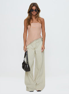 side view of model wearing Princess Polly Paxon Asymmetrical Top Beige Sleeveless straight 