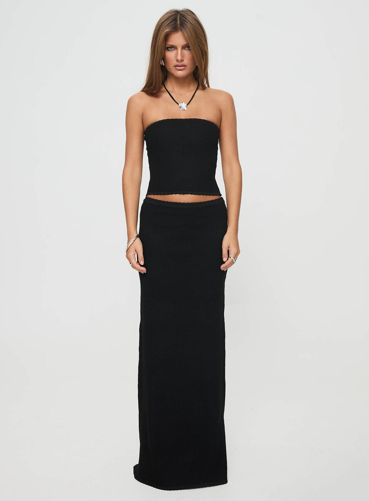 side view of model wearing Princess Polly Huckle Tube Top Black Sleeveless straight 