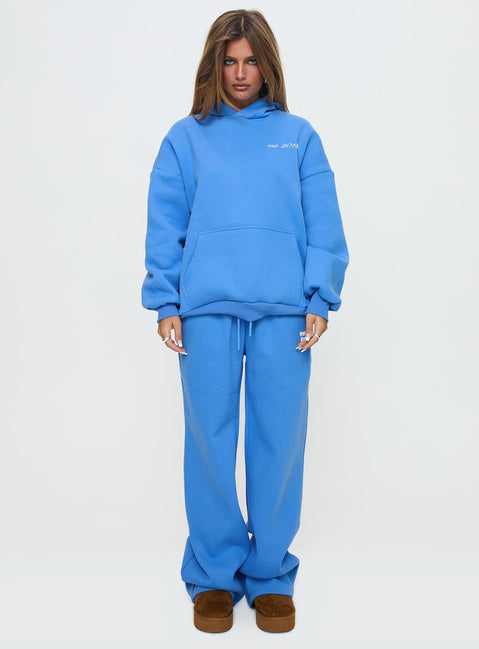 front view of model wearing Princess Polly Princess Polly Hooded Sweatshirt Bubble Text Blue / White Jumpers 