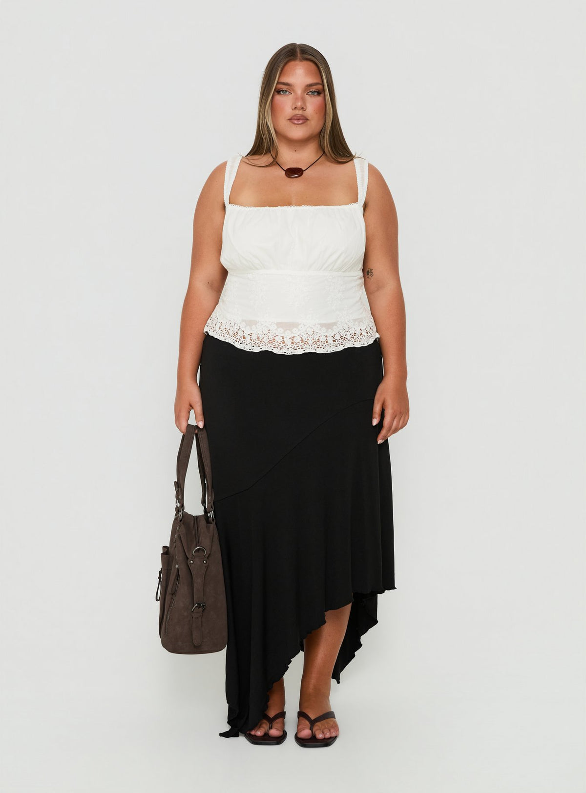 Showcasing the Futura Asymmetrical Midi Skirt Black Curve in womens-skirts with midi length Princess Polly