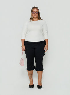 Showcasing Bailor Channel Waistband Capri Pants Black Curve womens-regular-pants with high-rise front view of model wearing Princess Polly