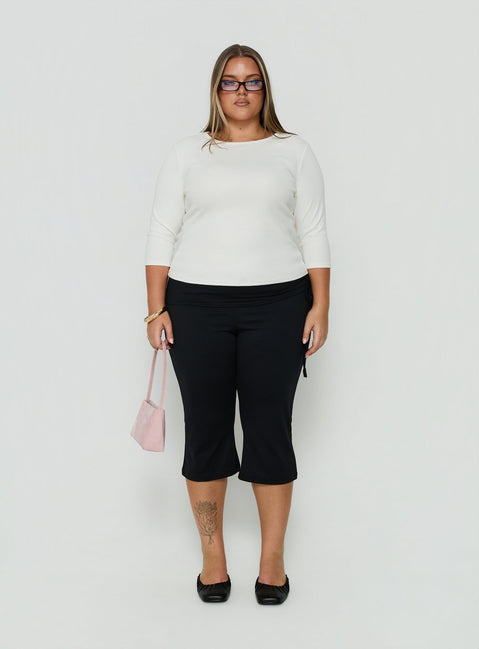 Showcasing Bailor Channel Waistband Capri Pants Black Curve womens-regular-pants with high-rise front view of model wearing Princess Polly