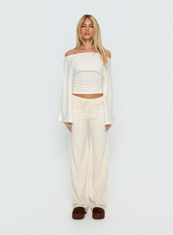 side view of model wearing Princess Polly Felisha Low Waist Knit Pants White Mid Rise Pants Pants 