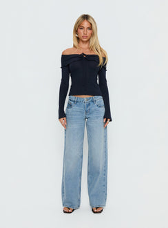 Showcasing Ellanor Low Rise Slouch Denim Jean Washed Mid Blue womens-jeans front view of model wearing Princess Polly