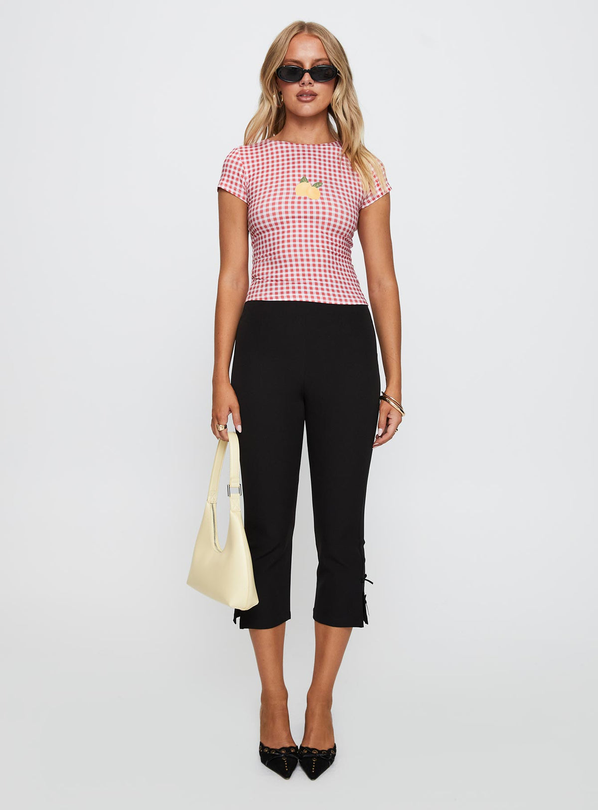 side view of model wearing Princess Polly Marcello Graphic Top Red Check Sleeveless Crew Neck 