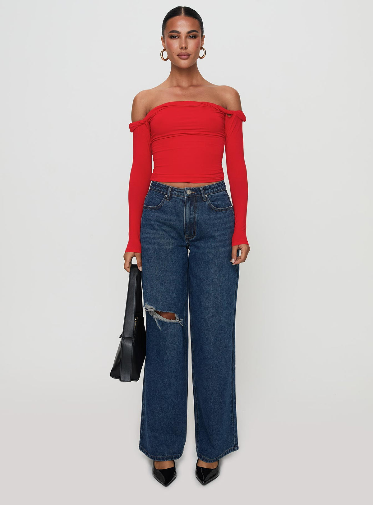 side view of model wearing Princess Polly Dusky Long Sleeve Top Red Full Sleeves straight 